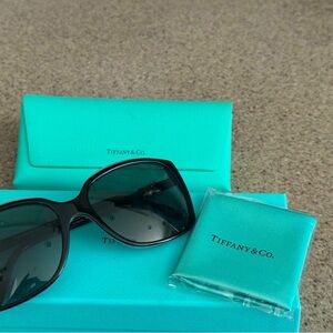 Tiffany and Co sunglasses with case and new eyeglass cloth. Box included.